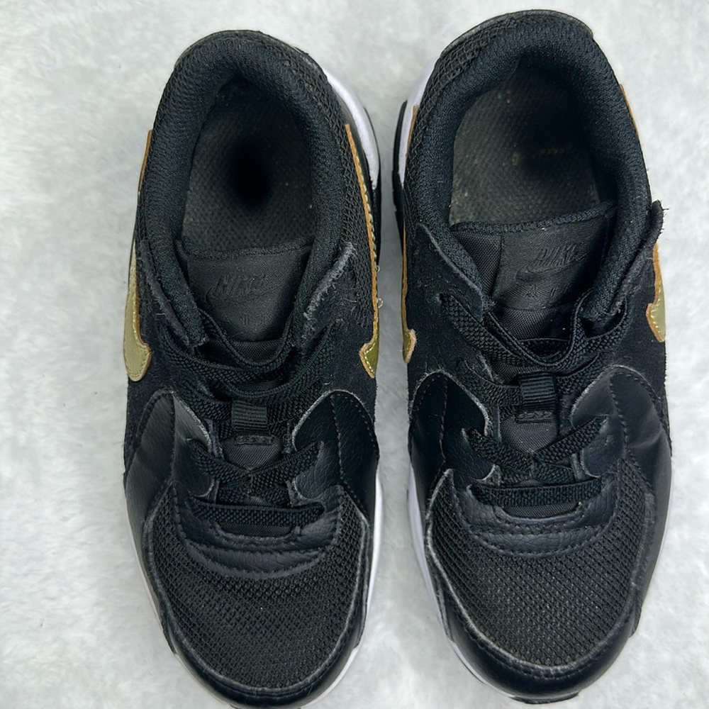 Toddlers black and gold Nike. Size 12C